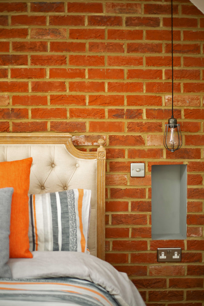 industrial-bedroom-exposed-brick-bed-lighting.jpg