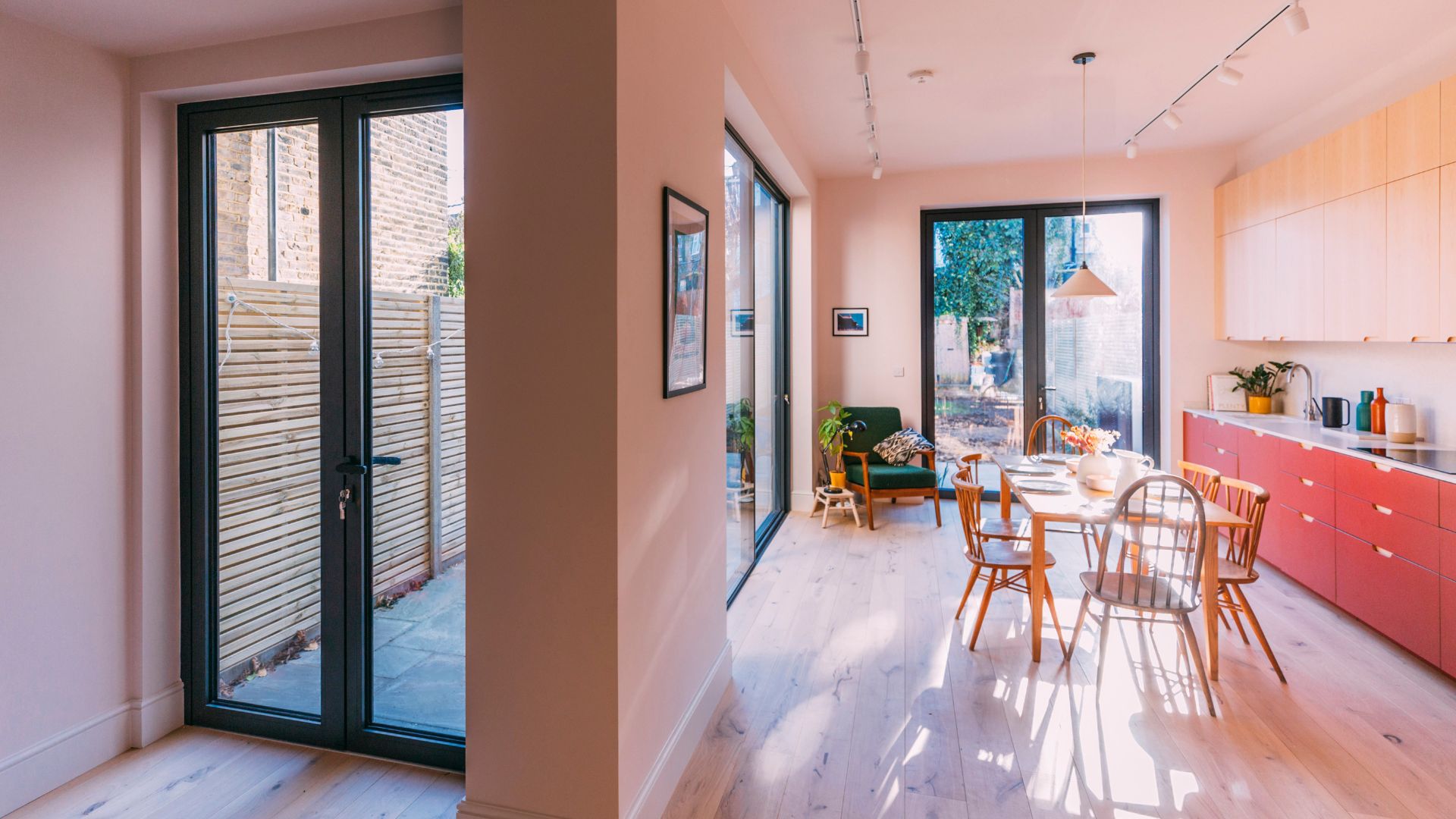 sunlit-kitchen-london-retrofit-pale-blue-red-cabinetry.jpg