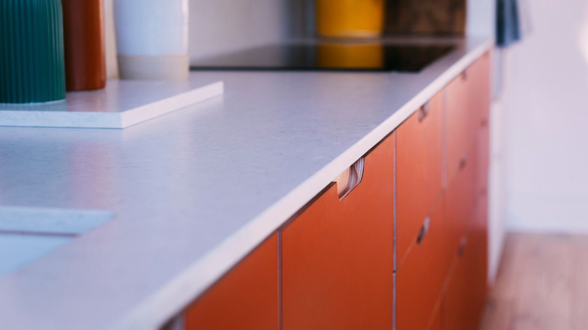 bespoke-red-orange-kitchen-joinery-detail-cutaway-handles.jpg