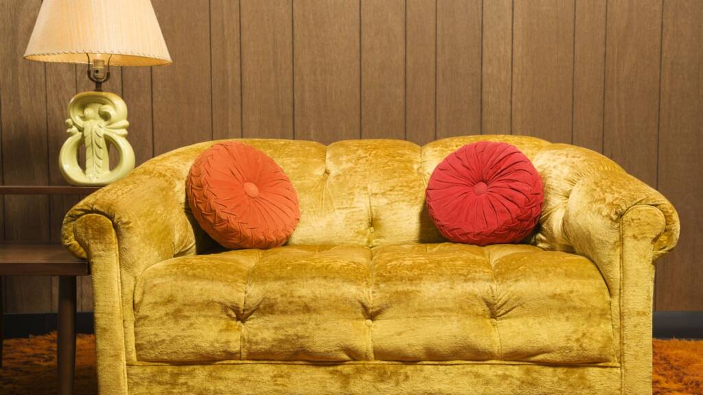 Image of an old retro sofa in a retro style house alluding to an older home with lack of heating