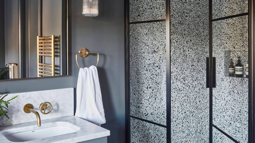 Luxurious bathroom design with bold tiles and stylish sink