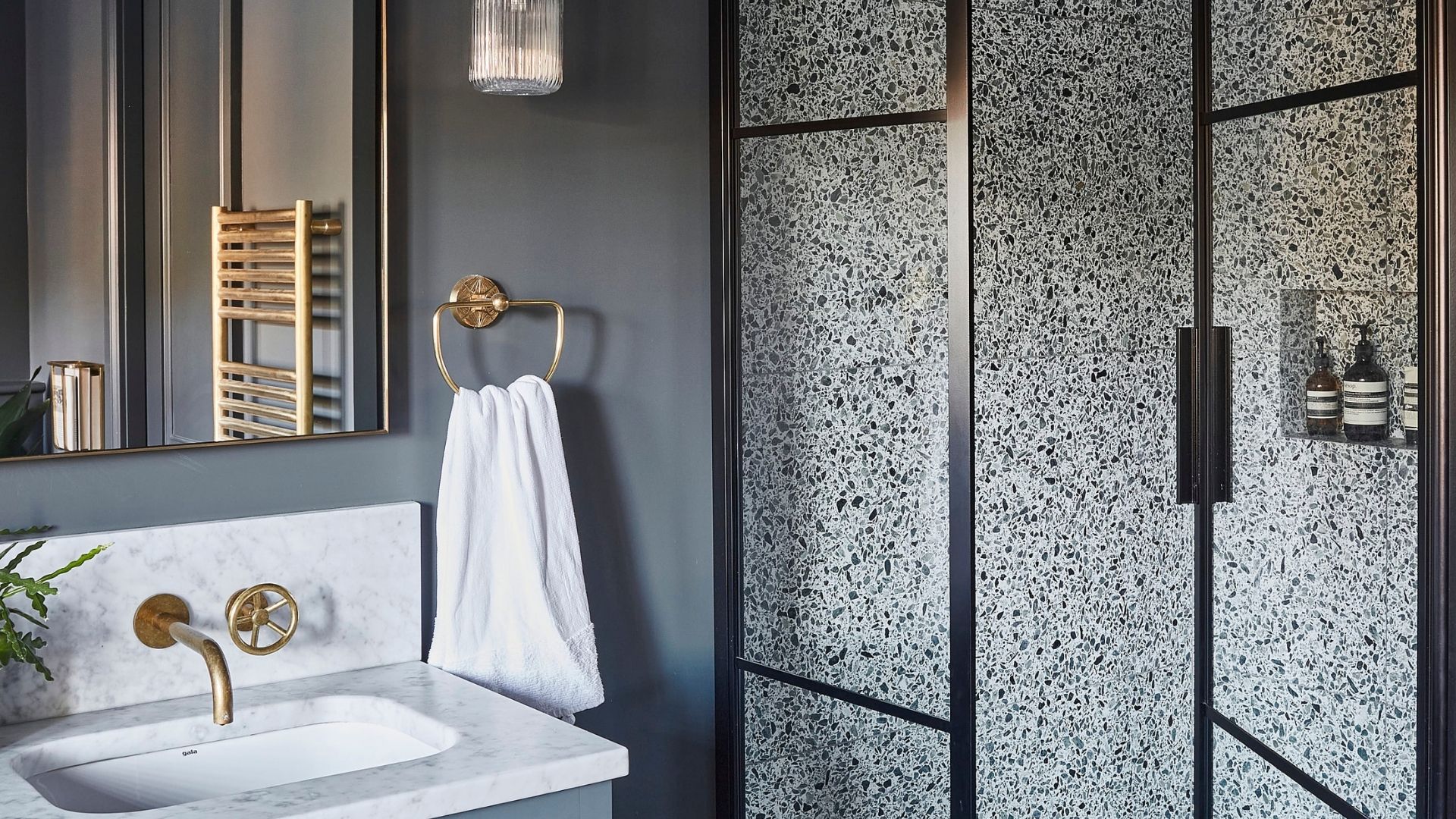 Pencil and Brick Architects Ltd — Luxurious bathroom design with bold tiles and stylish sink