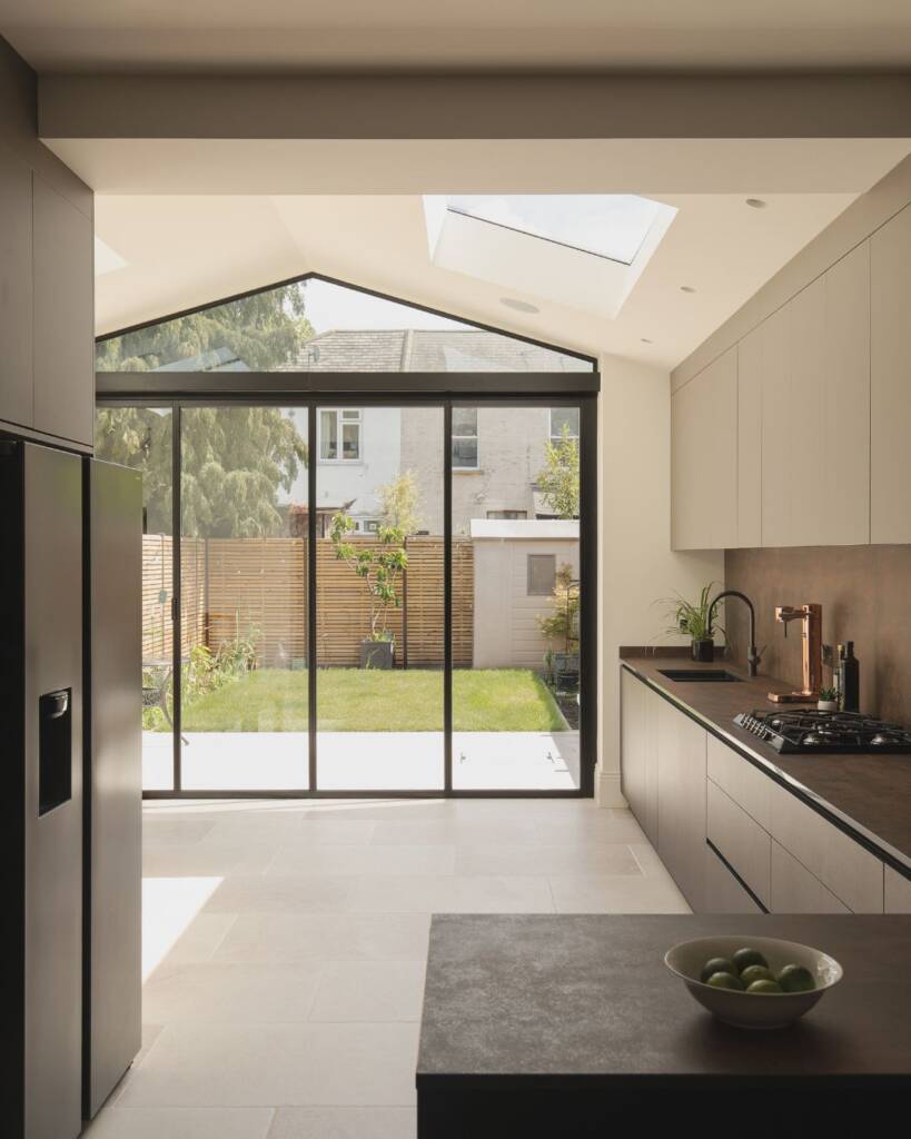 Reconfigured open plan ground floor layout in Newham, removing restrictive walls to create a fluid, continuous living space.
